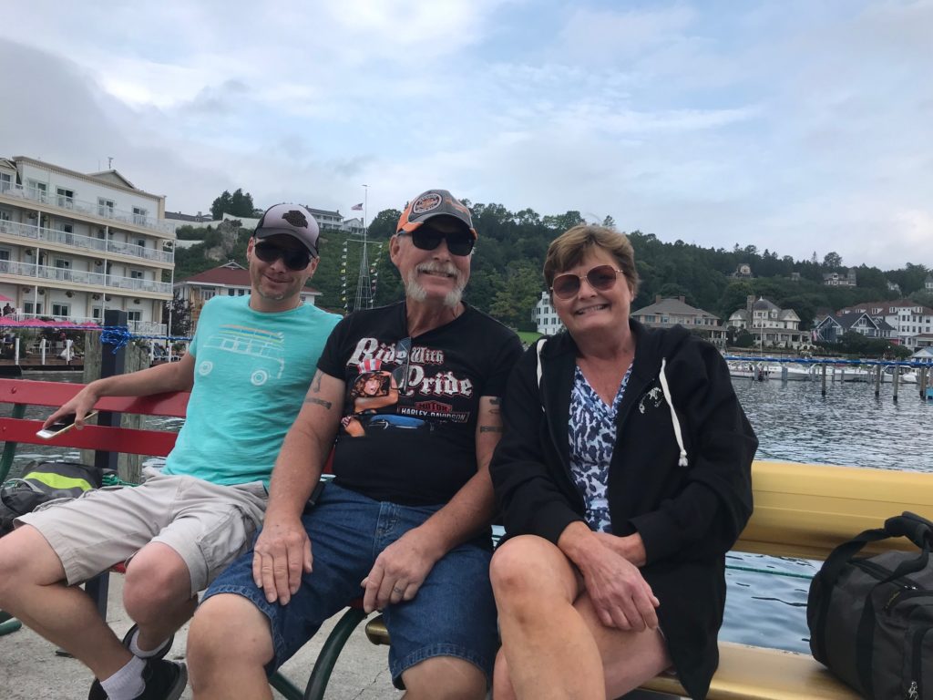 Me, my dad and my mom at the docks in Mackinac Island