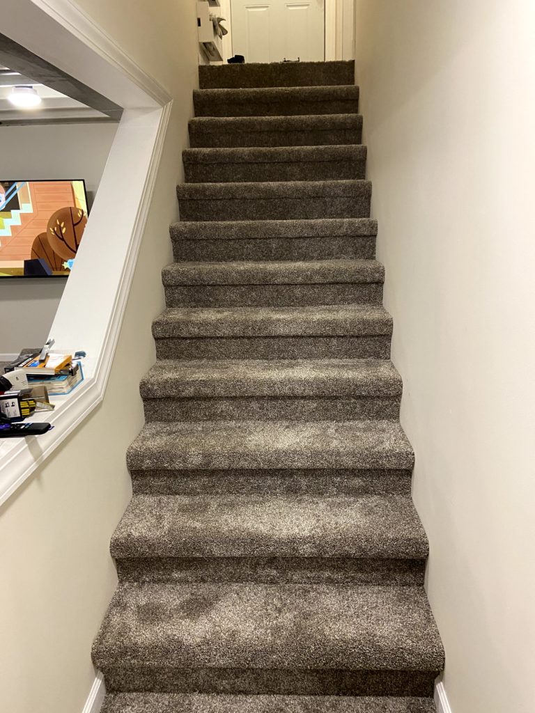 A look at the carpeted basement stairs
