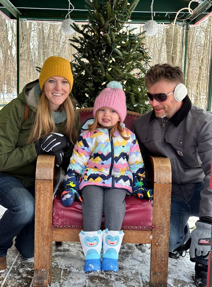 Meghan smiling, Riley looking confused with hot chocolate mustache, and me laughing at Riley