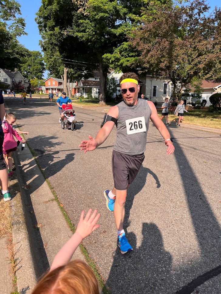 Riley giving me a high-five while running.