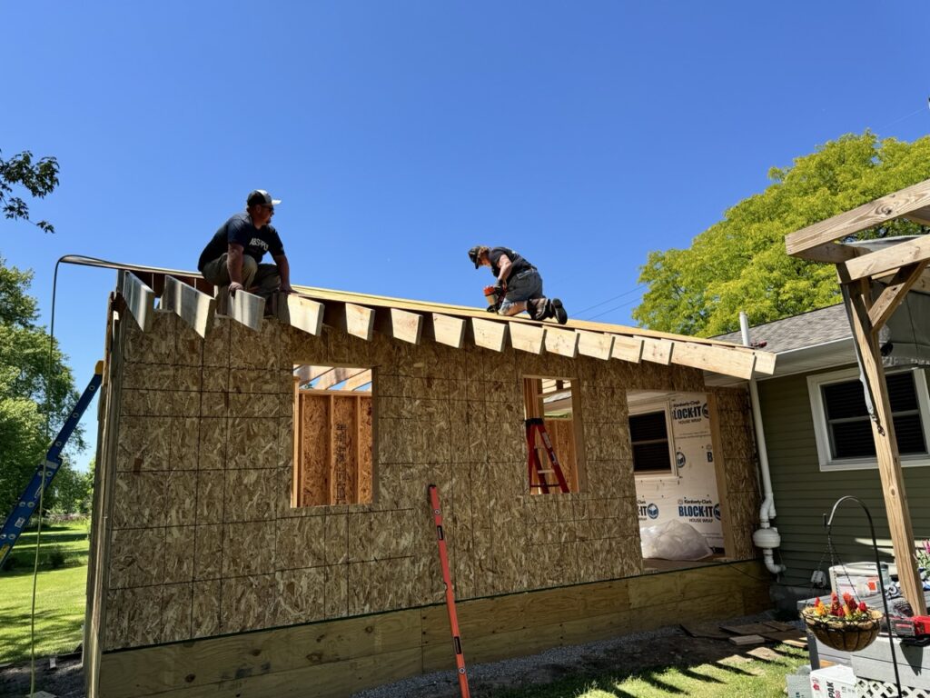 Dad and Trevor working the roof