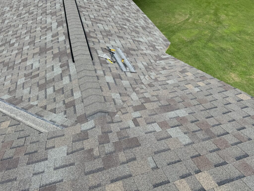 working the shingles into the existing roof