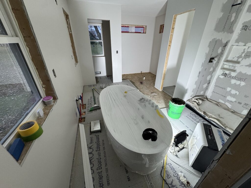 Cement board going down on the floor.