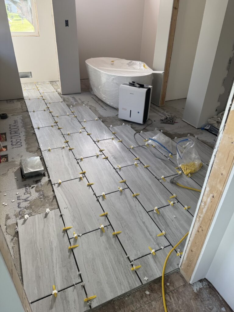 Tile flooring going down