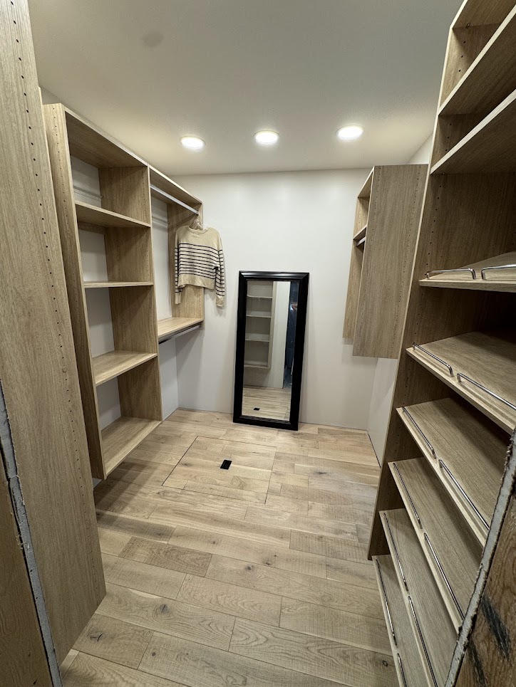 Walk-in closet with the organizers in place.